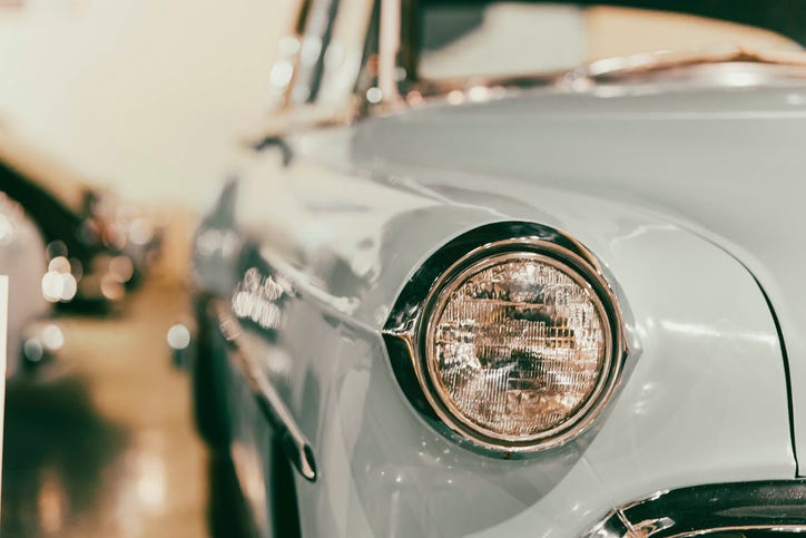 Classic Blue Retro looking Car Headlight with copy space and blurred background