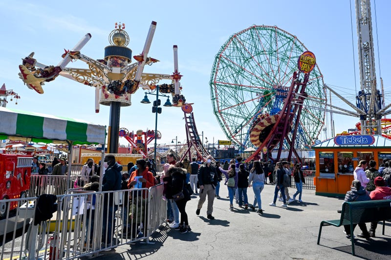 People visit Luna Park on the opening day of the season at Coney Island.