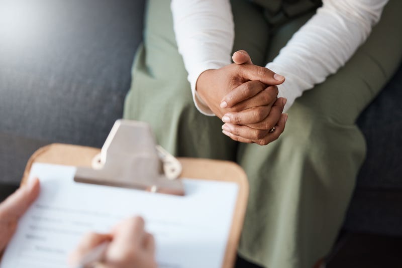 Person speaking to a counselor