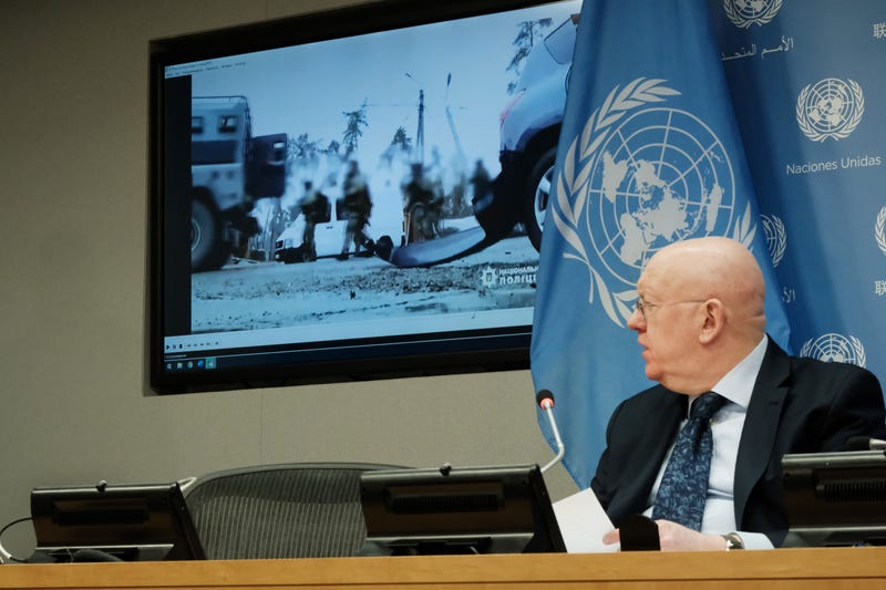 Permanent Representative of the Russian Federation to the United Nations (UN), Ambassador Vassily Nebenzia plays a video purportedly from Bucha as he speaks to the media about charges of a massacre in the Ukrainian town of Bucha at United Nations headquarters on April 04, 2022 in New York City