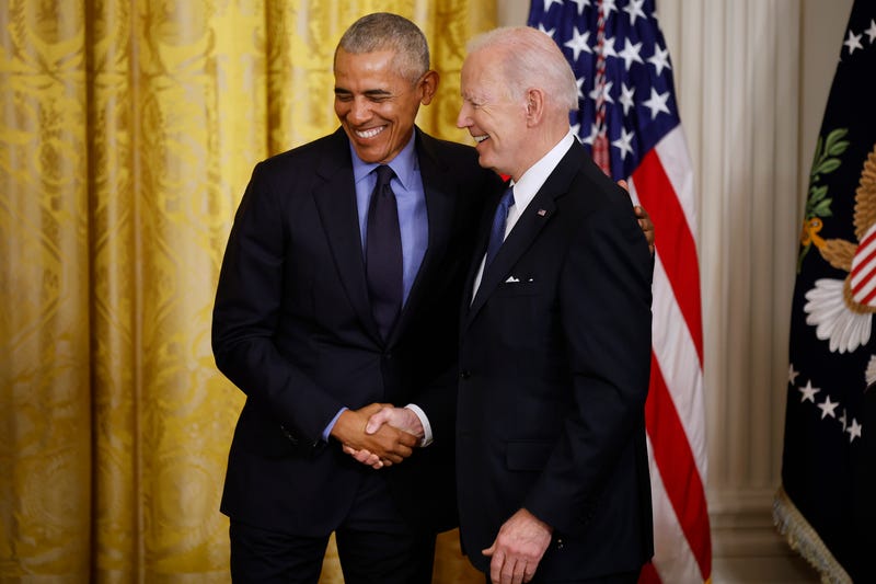 Former President Barack Obama (L) and U.S. President Joe Biden shake hands during an event to mark the 2010 passage of the Affordable Care Act in the East Room of the White House on April 05, 2022 in Washington, D.C.