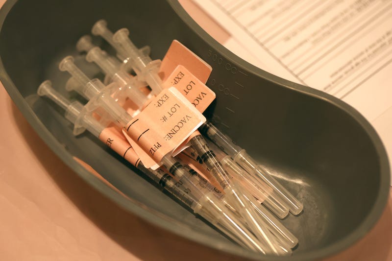 COVID-19 vaccines sit on a table at a COVID-19 vaccination clinic on April 6, 2022