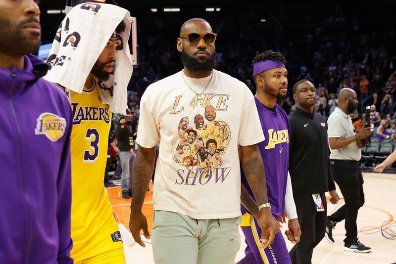 LeBron James #6 and Anthony Davis #3 of the Los Angeles Lakers walk off the court following the NBA game at Footprint Center on April 05, 2022 in Phoenix, Arizona. 