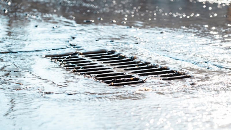 A storm water grate - stock photo