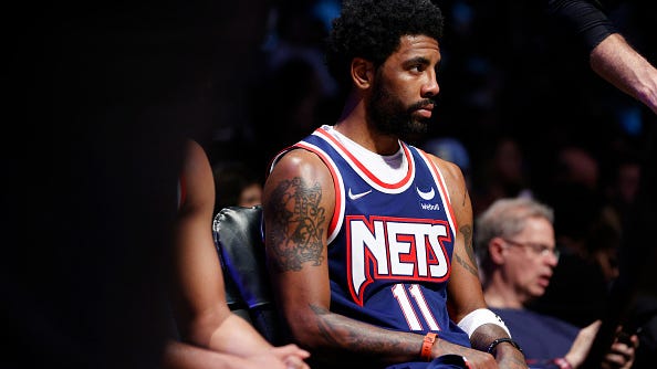 Kyrie Irving reverses course, opts into final year of deal with Nets