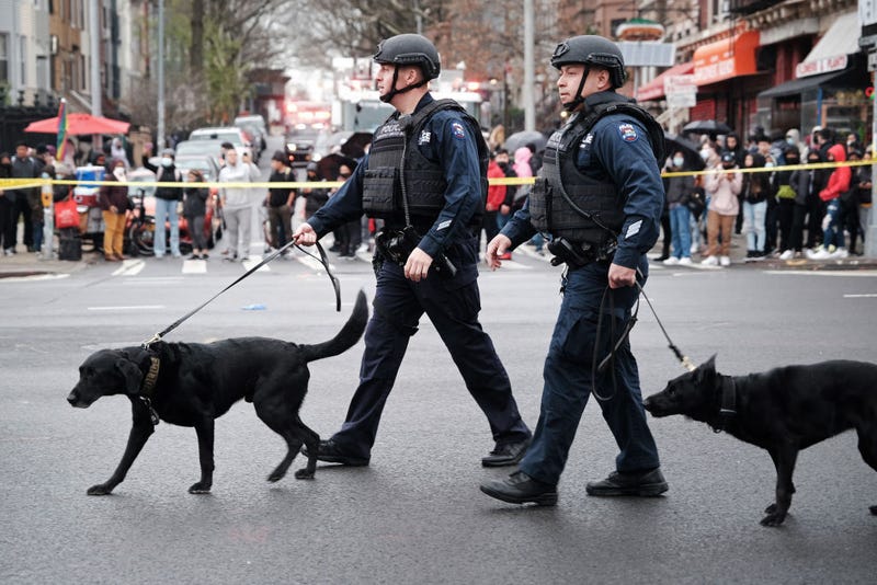 Police and emergency responders gather at the site of a reported shooting of multiple people outside of the 36 St subway station on April 12, 2022 in the Brooklyn borough of New York City.