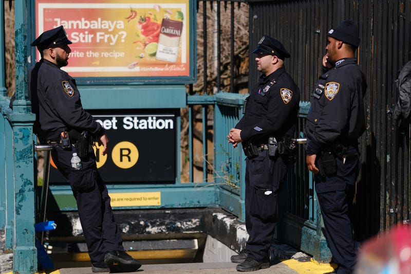 NYPD officers at the scene of a shooting at the 36 Street subway station on April 12, 2022 in Brooklyn
