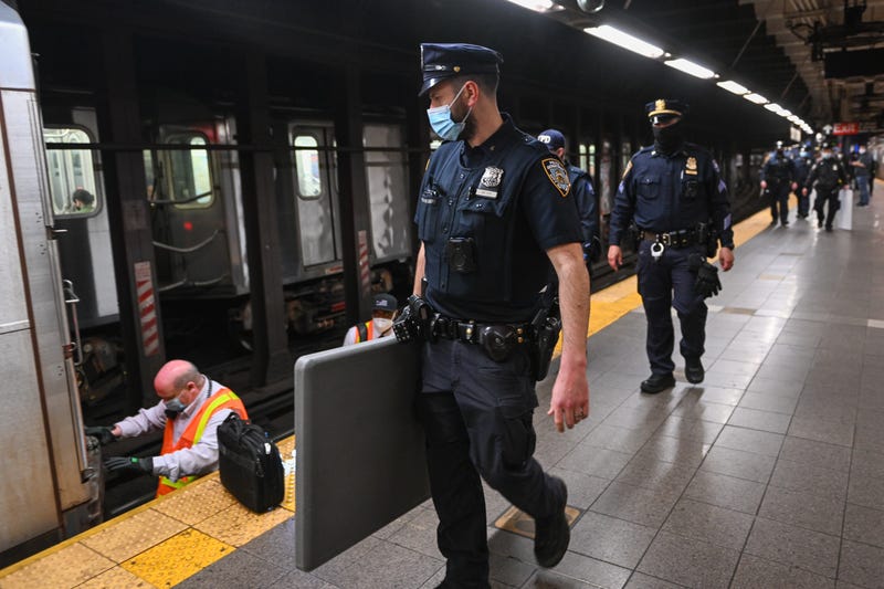 NYPD officers investigating a different incident in the subway -- not the shooting on Friday.