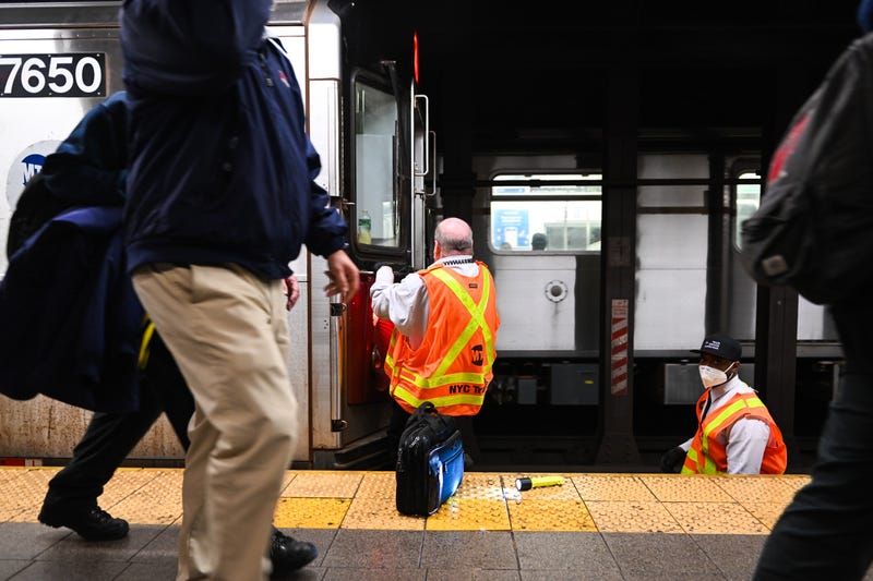 An April 2022 shot of MTA workers investigating an emergency brake pull at the Union Square subway station.
