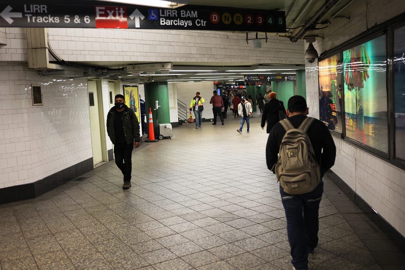 Subway riders pass through the Atlantic Avenue subway station in Brooklyn