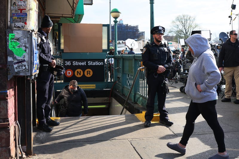 NYPD officers stand guard at the 36th Street subway station on April 13, 2022 in the Sunset Park neighborhood of Brooklyn