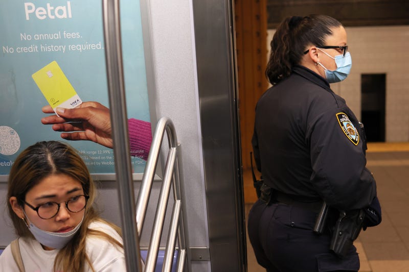 An NYPD officer looks into the R train at the 36 Street subway station on April 13, 2022 in the Sunset Park neighborhood of Brooklyn in New York City.