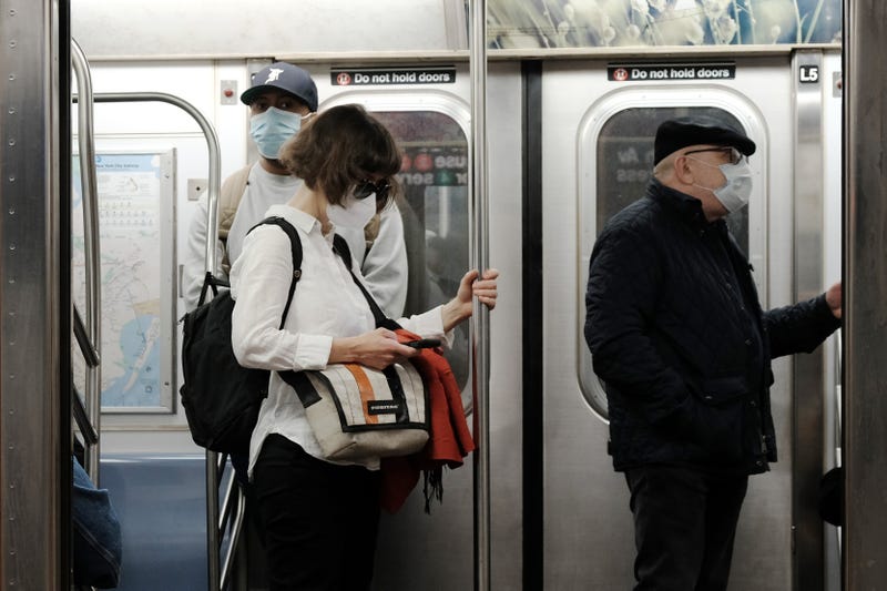 People ride in a Brooklyn subway train this year