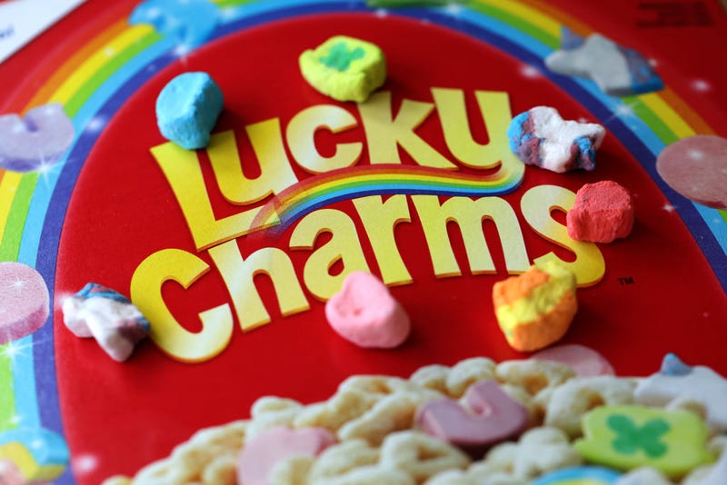 FILE - In this photo illustration, marshmallows from General Mills Lucky Charms cereal are displayed on a box on April 18, 2022 in San Anselmo, California. The U.S. Food and Drug Administration is investigating reports of hundreds of people that have fallen ill and have experienced symptoms of nausea, diarrhea and vomiting after eating Lucky Charms cereal. 