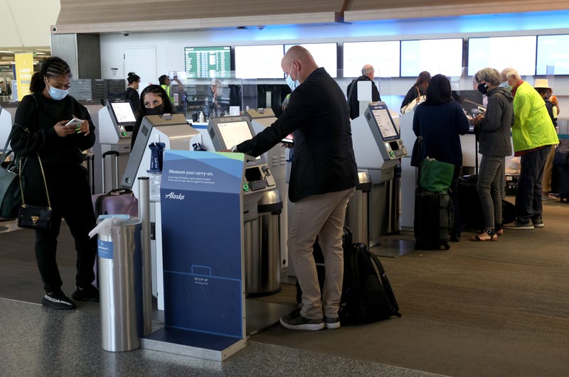 : Alaska Airlines passengers check in for flights at San Francisco International Airport on April 19, 2022 in San Francisco, California.