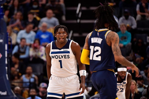 Ja Morant #12 of the Memphis Grizzlies handles the ball against Anthony Edwards #1 of the Minnesota Timberwolves during Game Two of the Western Conference First Round at FedExForum on April 19, 2022 in Memphis, Tennessee.