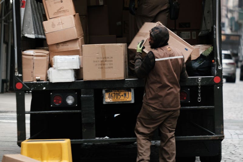A United Parcel Service (UPS) worker delivers boxes in Manhattan on April 26, 2022 in New York City. The Atlanta-based courier announced that revenue rose 6.4% to $24.4 billion in the first quarter. (Photo by Spencer Platt/Getty Images)