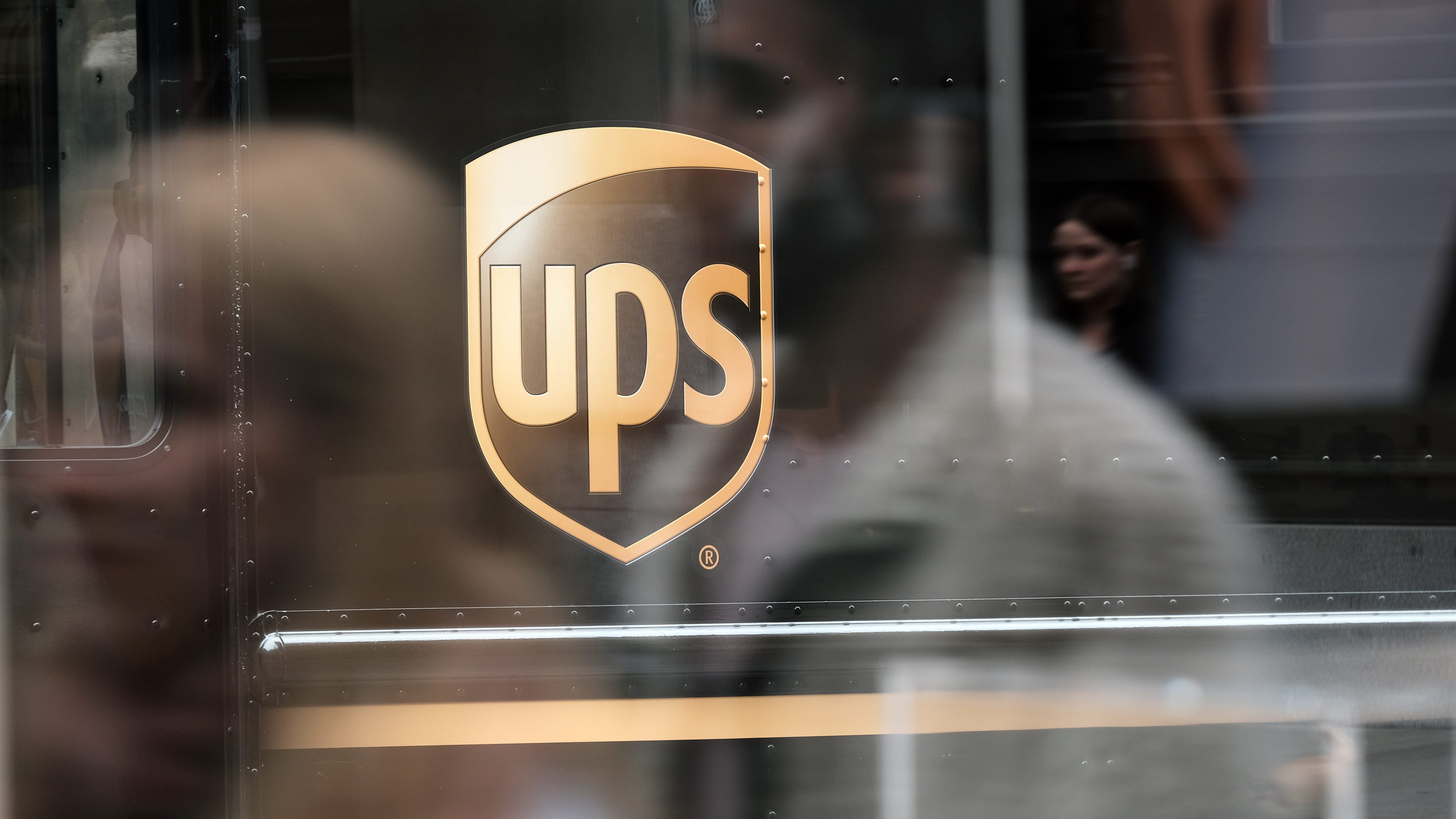 UPS driver saves two dogs from drowning