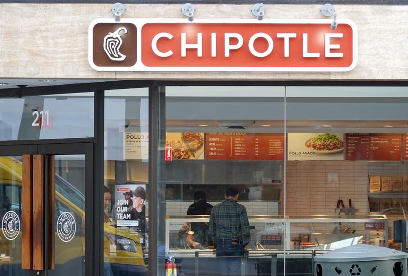 A customer orders food at a Chipotle restaurant on April 26, 2022 in San Francisco, California.