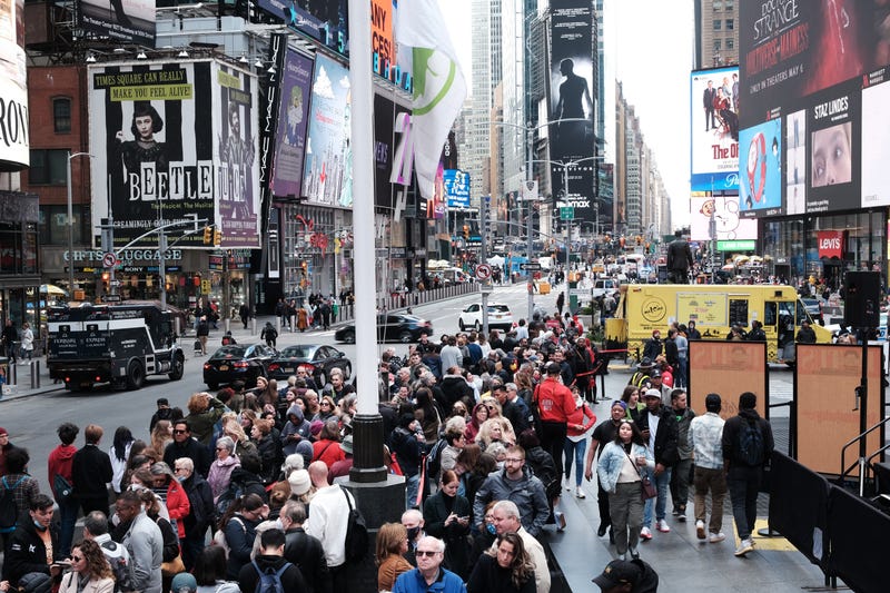 People wait in line to buy theater tickets in Times Square on April 27, 2022 in New York City. Unlike other parts of Manhattan, Times Square is quickly returning to its pre-pandemic population with Broadway shows and area hotels at near full capacity on many nights. While office workers in Manhattan have yet to return in large numbers, Times Square is seeing a boom in tourists visiting the historic entertainment core of Manhattan. Dr. Anthony Fauci announced today the America is officially out of the pandemic stage of the Covid-19. 