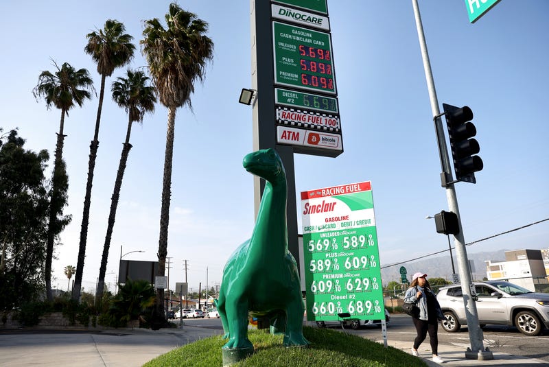 Gas prices are displayed at a Sinclair station.