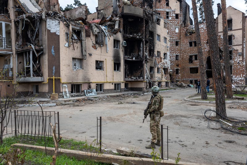 A Ukrainian army soldier stands guard at the war damaged Irpinsky Lipky residential complex following the visit of United Nations Secretary-General Antonio Guterres on April 28, 2022 in Irpin, Ukraine