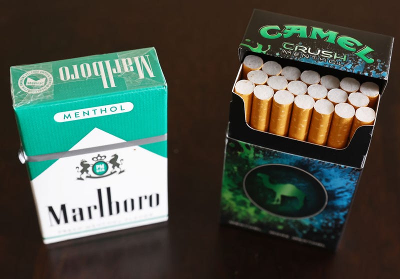 In this photo illustration, packs of menthol cigarettes sit on a table on April 28, 2022 in Los Angeles, California. The Food and Drug Administration (FDA) is proposing to ban both menthol-flavored cigarettes and flavored cigars in a move hailed by public health experts which could potentially lead to 1.3 million people quitting smoking. (Photo by Mario Tama/Getty Images)