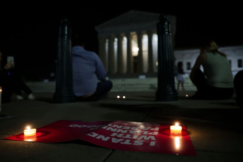 Demonstrators place candles outside of the U.S. Supreme Court on May 02, 2022 in Washington, DC. In an initial draft majority opinion obtained by Politico, Supreme Court Justice Samuel Alito allegedly wrote that the cases Roe v. Wade and Planned Parenthood of Southeastern v. Casey should be overruled, which would end federal protection of abortion rights across the country. (Photo by Kevin Dietsch/Getty Images)