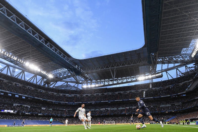 Joao Cancelo of Manchester City FC competes for the ball with Dani Carvajal of Real Madrid CF during the UEFA Champions League Semi Final Leg Two match between Real Madrid and Manchester City at Estadio Santiago Bernabeu on May 04, 2022 in Madrid, Spain.