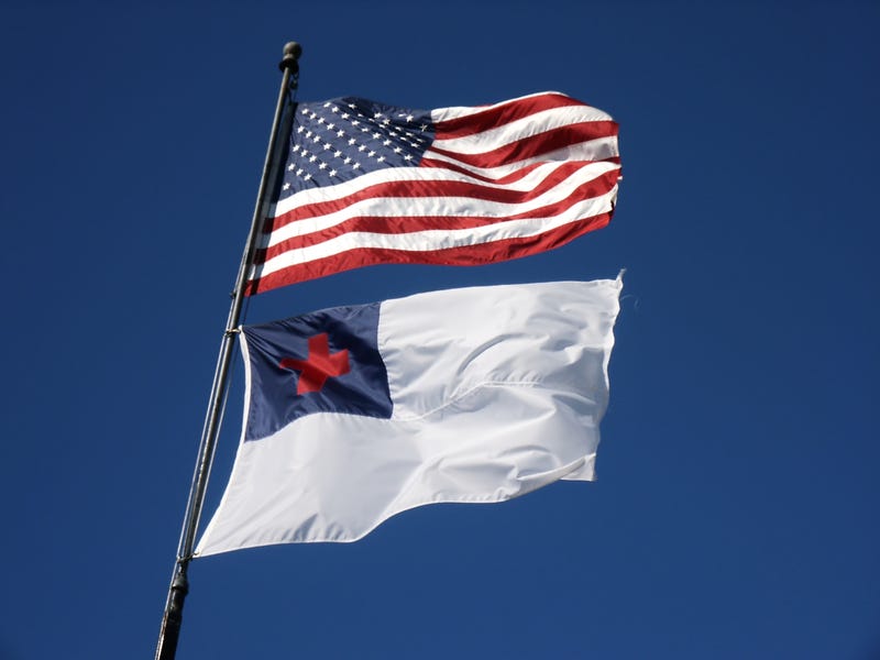 US flag flying above the Christian (Protestant) flag. 