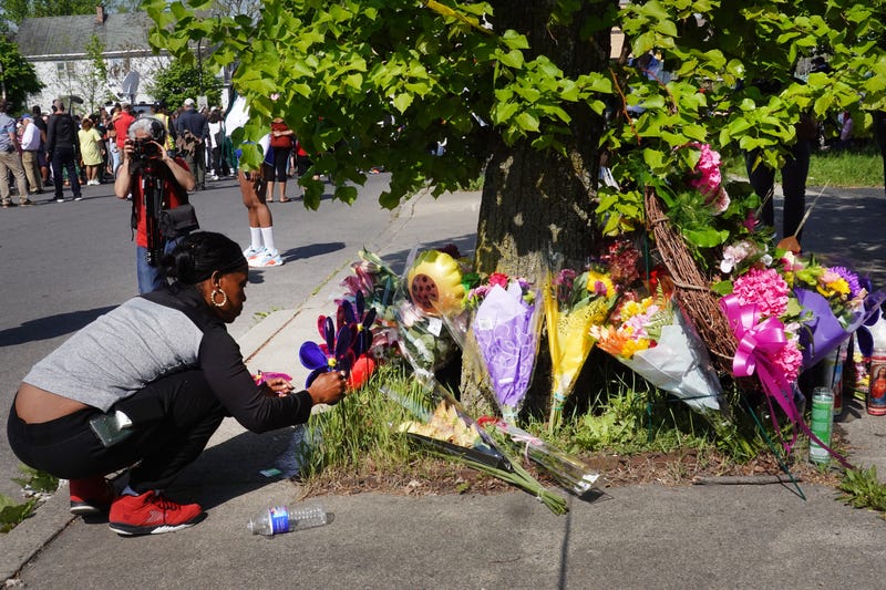 Flowers are left at a makeshift memorial outside of Tops market on May 15, 2022 in Buffalo, New York. Yesterday a gunman opened fire at the store, killing ten people and wounding another three.