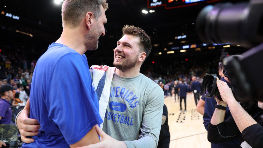 Luka Doncic embraces Dirk Nowitzki after Mavs blitz Suns en route to WCF