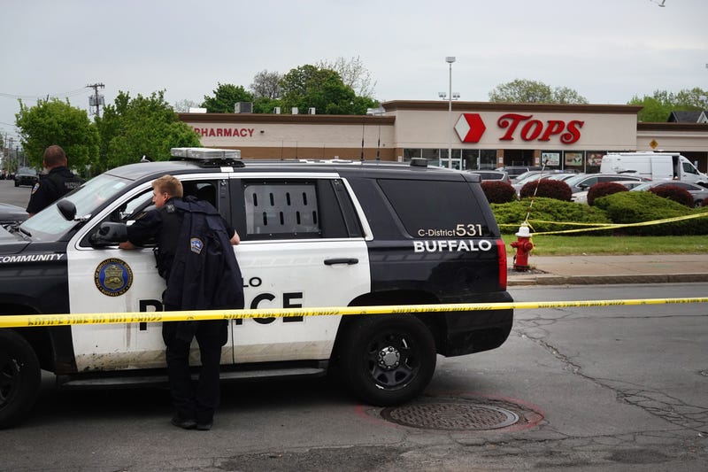 Police and FBI agents investigating the shooting at Tops Market on May 16, 2022 in Buffalo, New York.