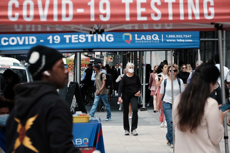 People walk past a Covid testing site on May 17, 2022 in New York City