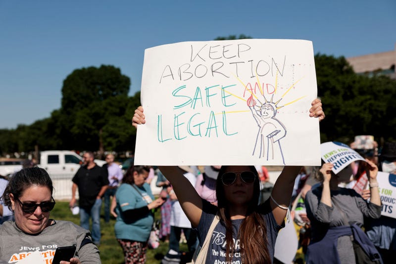 A protester carries a sign as they attend the "Jewish Rally for Abortion Justice" rally at Union Square near the U.S. Capitol on May 17, 2022 in Washington, DC.