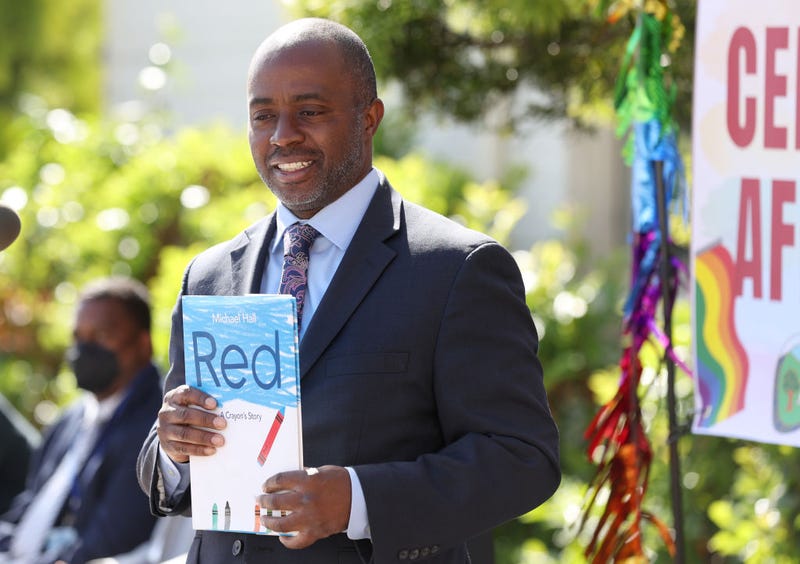 California State Superintendent of Schools Tony Thurmond holds the book "Red: A Crayon's Story" during a news conference at Nystrom Elementary School on May 17, 2022 in Richmond, California