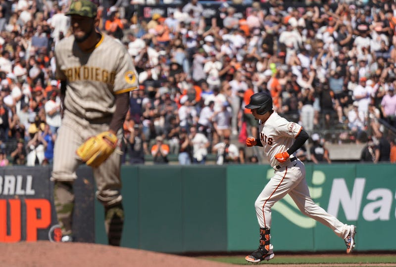 Wilmer Flores #41 of the San Francisco Giants trots around the bases after hitting a solo home run off of Robert Suarez #75 of the San Diego Padres in the bottom of the eighth inning at Oracle Park on May 21, 2022 in San Francisco, California.