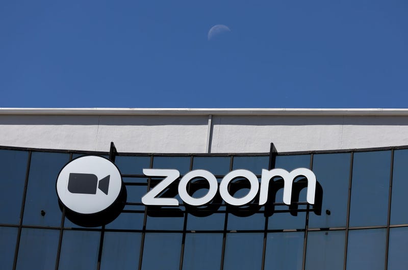 The moon sets behind the Zoom Video Communications headquarters on May 23, 2022 in San Jose, California.