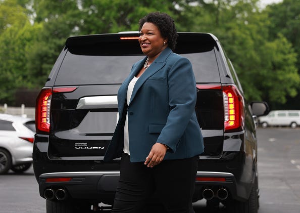 Democratic gubernatorial candidate Stacey Abrams arrives for a press conference at the Israel Baptist Church as voters head to the polls during the Georgia primary on May 24, 2022 in Atlanta, Georgia. Election Day allows people to vote on Republican and Democratic nominees for offices.
