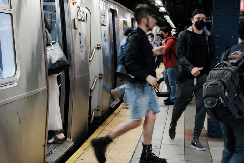 People walk through a Manhattan subway station on May 24, 2022 in New York City.