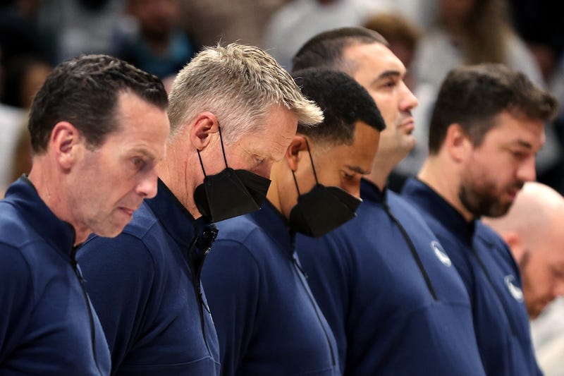 Head coach Steve Kerr of the Golden State Warriors stands for a moment of silence for the victims of the mass shooting at Robb Elementary School in Uvalde, TX prior to in Game Four of the 2022 NBA Playoffs Western Conference Finals against the Dallas Mavericks at American Airlines Center on May 24, 2022 in Dallas, Texas.