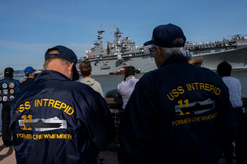 USS Intrepid former crew members watch Marines and Navy sailors from the USS Bataan during their arrival for Fleet Week 2022 as seen from the Intrepid Museum on May 25, 2022 in New York City. Fleet Week returned this year in full capacity with over 3,000 sailors partaking across multiple vessels entering New York City’s ports, according to reports. This is the first year since the start of the COVID-19 pandemic that Fleet Week has returned.