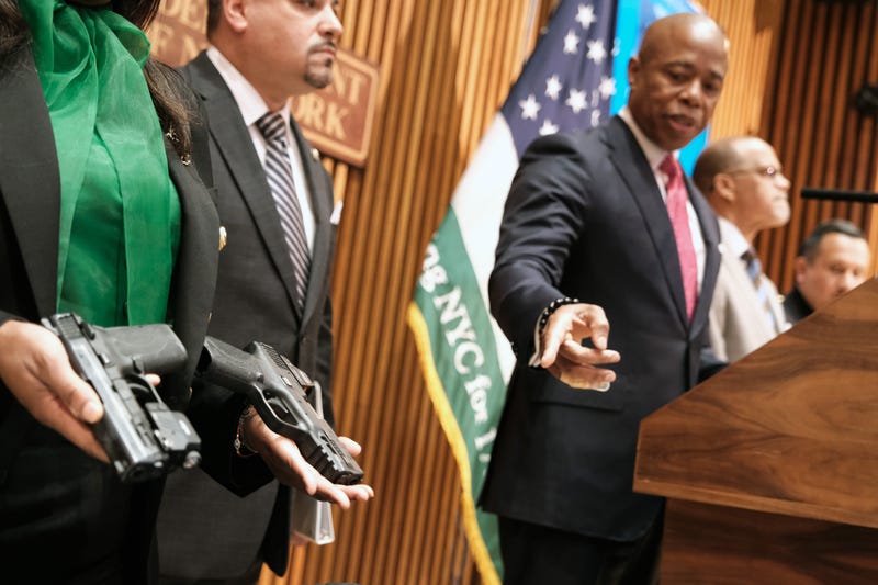 Guns confiscated at New York City public schools are displayed at a news conference with Mayor Eric Adams at police headquarters on May 25, 2022