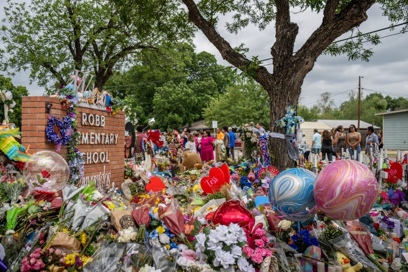 People visit a memorial dedicated to the 19 children and two adults killed on May 24th during the mass shooting at Robb Elementary School on May 31, 2022 in Uvalde, Texas. 