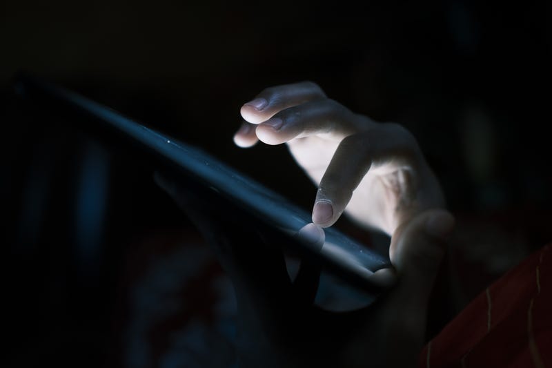 Spooky close up of man's hand texting