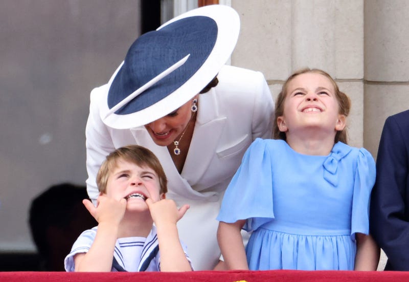 Prince Louis of Cambridge. pulls a face as he watches the RAF flypast with Catherine, Duchess of Cambridge and Princess Charlotte of Cambridge