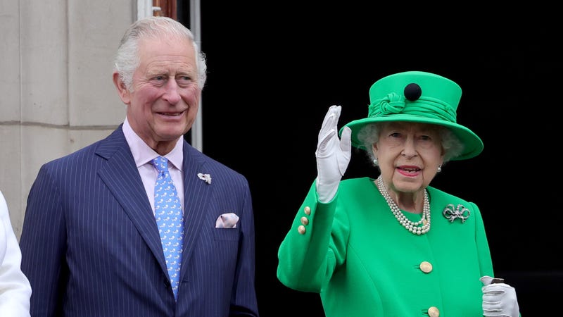 Prince Charles, Prince of Wales {now King Charles III) and Queen Elizabeth II stand on the balcony during the Platinum Pageant on June 5, 2022 in London, England. The Platinum Jubilee of Elizabeth II is being celebrated from June 2 to June 5, 2022, in the UK and Commonwealth to mark the 70th anniversary of the accession of Queen Elizabeth II on Feb. 6, 1952.