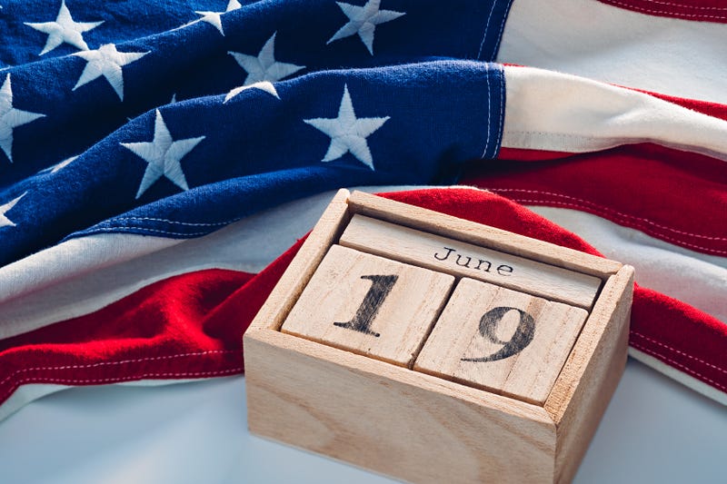 Cute wooden blocks calendar with Juneteenth National Independence Day June, 19 date with US flag.