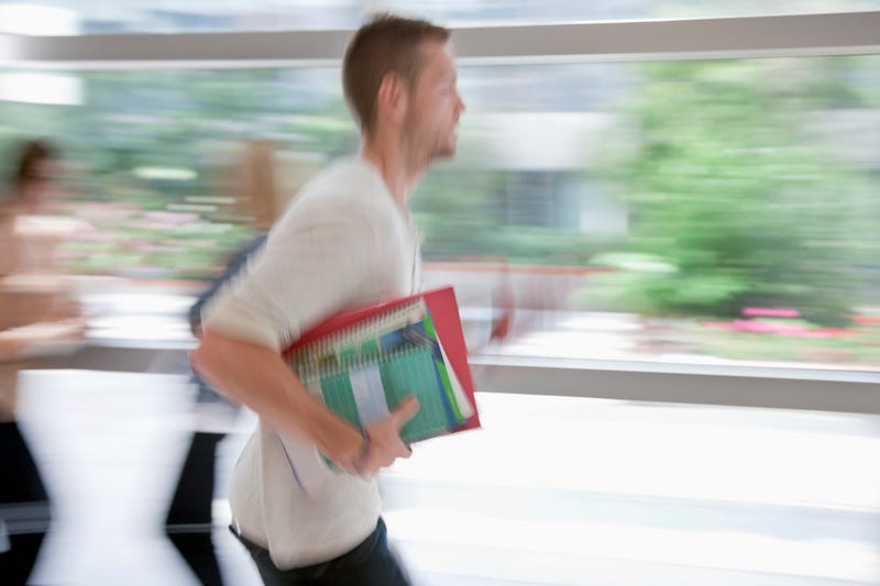 Blurred student running late