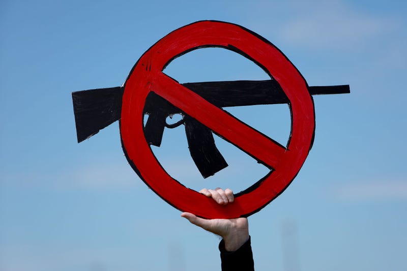 Ed Mackenzie holds a sign during the second March for Our Lives rally against gun violence at Pine Trails Park on June 11, 2022 in Parkland, Florida. 